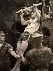 Bradley Dickens doing a pullup.